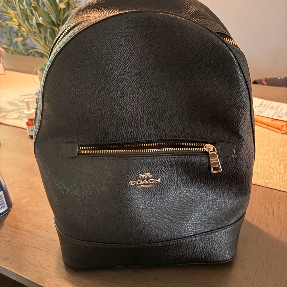 Brand new black coach backpack used one time in extremely excellent condition